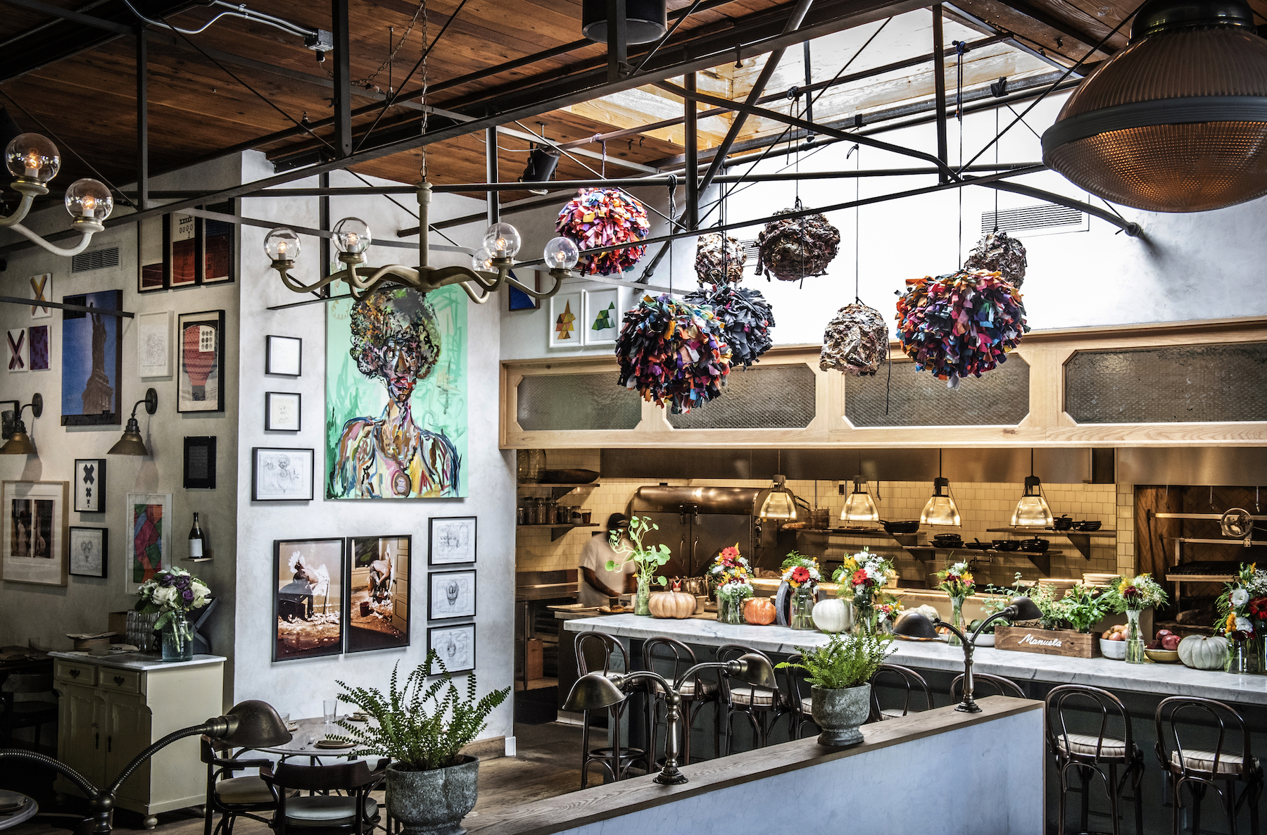 Interior of Manuela featuring artworks hung on the walls