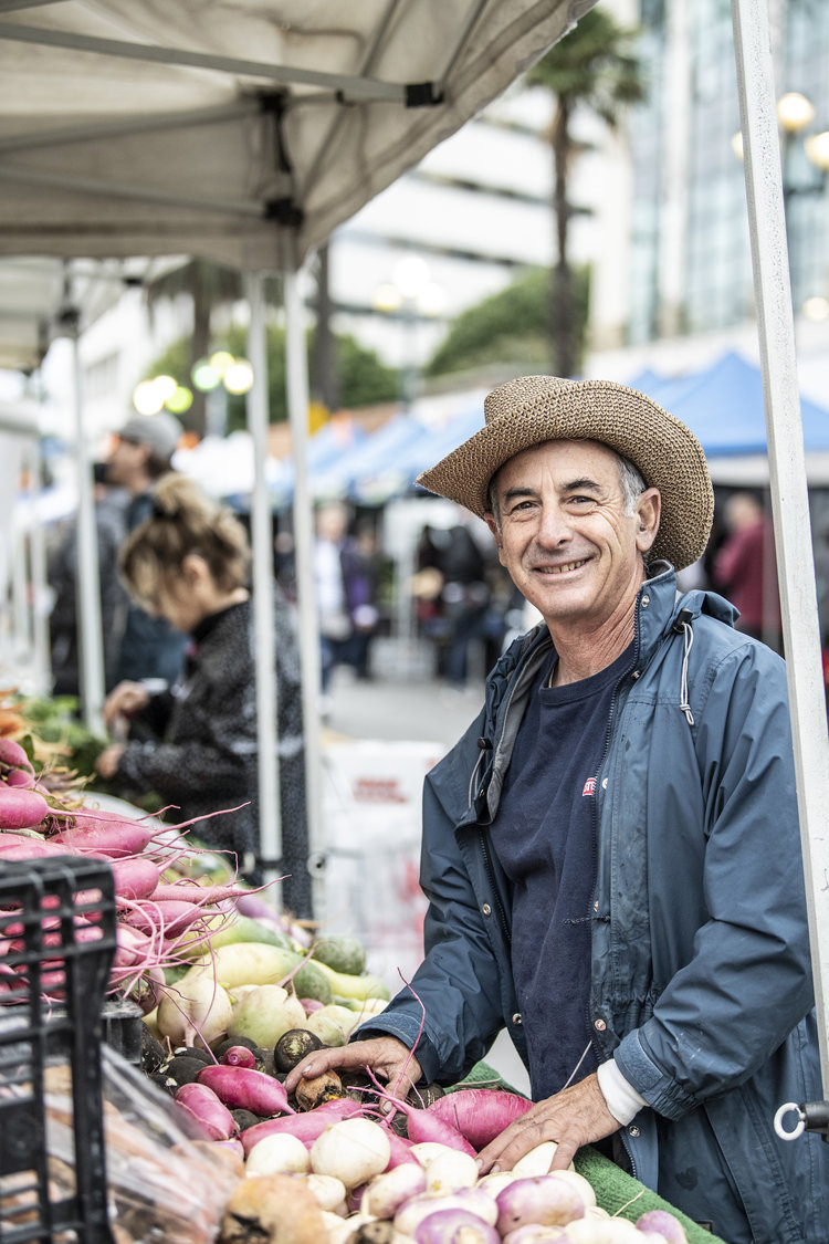 Local supplier with produce at market