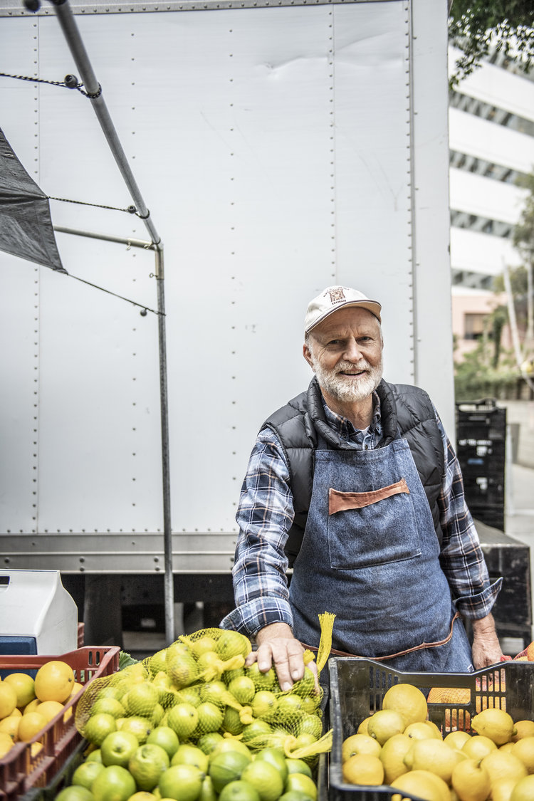 Local supplier with produce at market